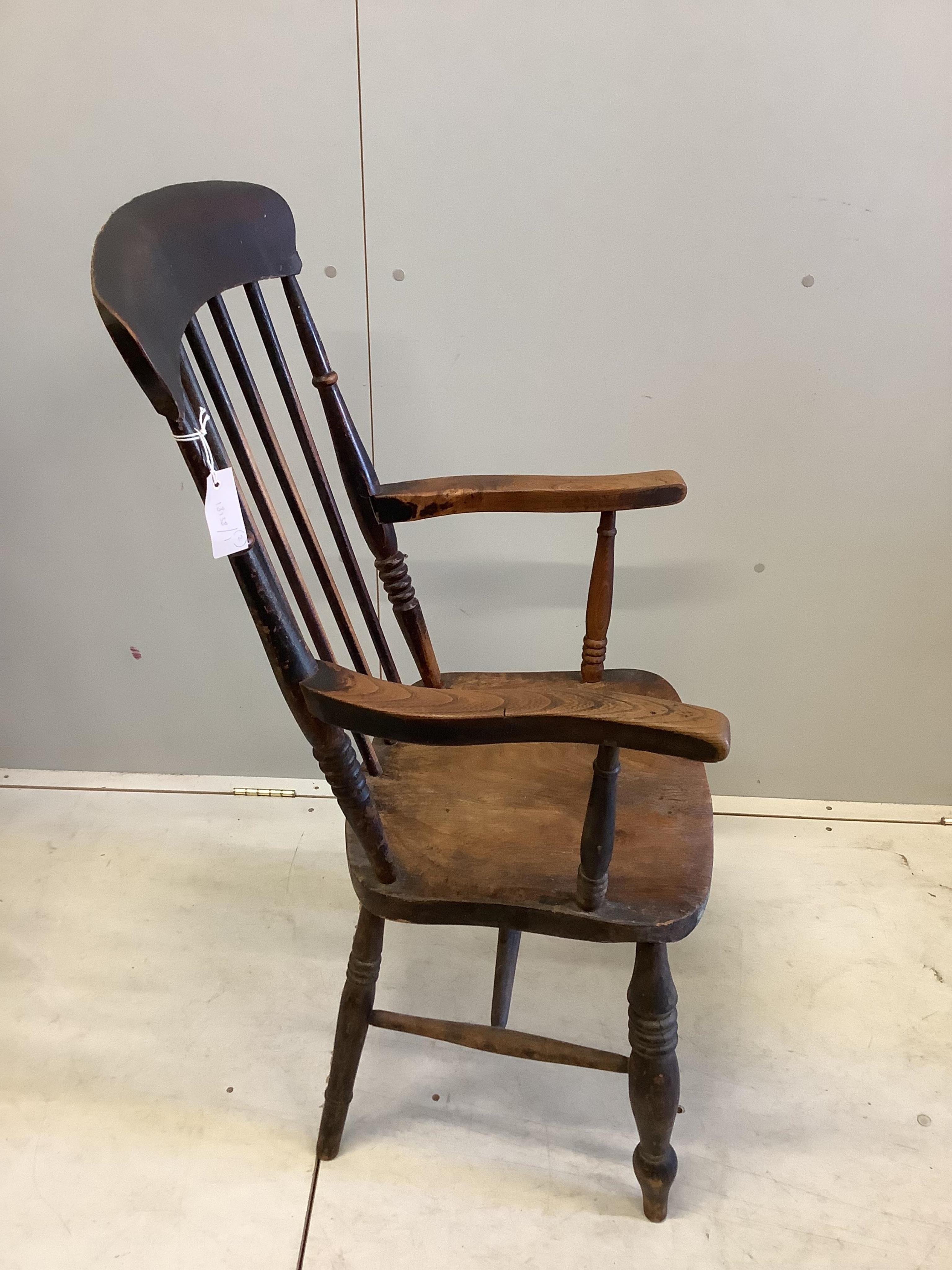 Two Victorian elm and beech Windsor comb back armchairs, larger width 58cm, depth 43cm, height 111cm